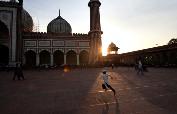 An Indian Muslim child runs at the Jama Masjid on the first night of Ramadan in New Delhi, India.